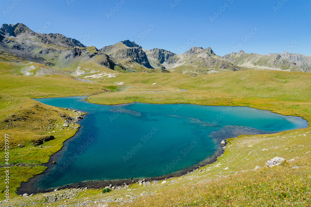 Picturesque lake in the mountains in the valley