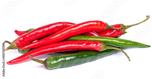 a bunch of red and green chili peppers on a white background. close-up, macro