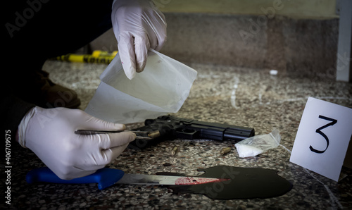 Crime scene, murder, investigation, police find discarded gun used by killer, taken as evidence of murder, police find drugs and bloody knife