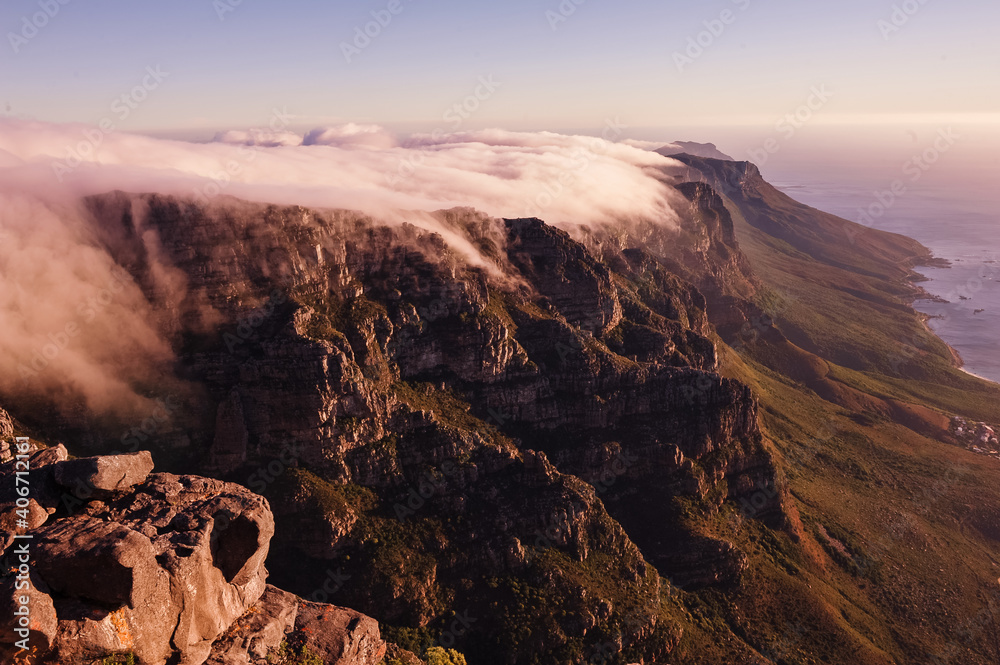 Clouds over the Table Mountain in Cape Town at a sunset hour