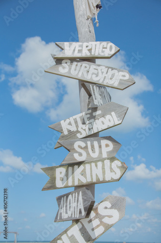 Funny Wooden Beach Signs And Blue Sky