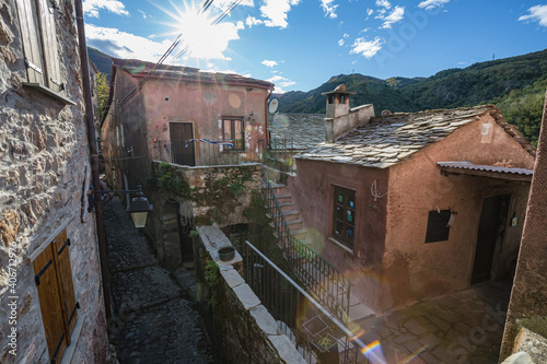 Fototapeta Naklejka Na Ścianę i Meble -  View of empty stone streets of an abandoned mountain village with a few remaining residents