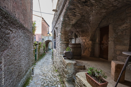 Fototapeta Naklejka Na Ścianę i Meble -  View of empty stone streets of an abandoned mountain village with a few remaining residents