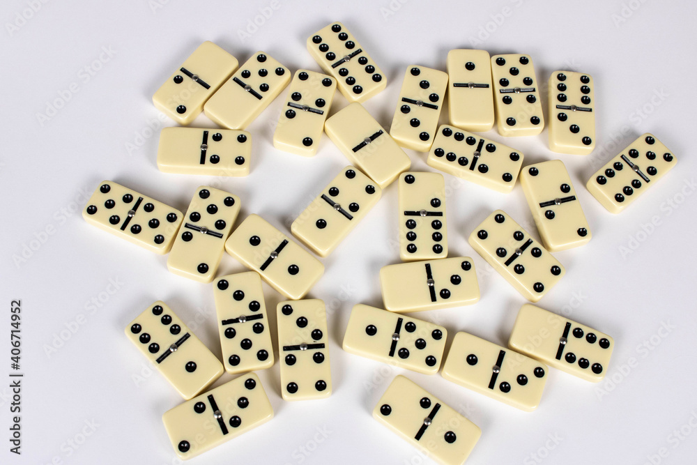A game of dominoes on a light background. Close-up. Selective focus. A game of dominoes on a light background. Close-up. Selective focus.