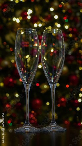 two empty champagne glasses and defocused lights