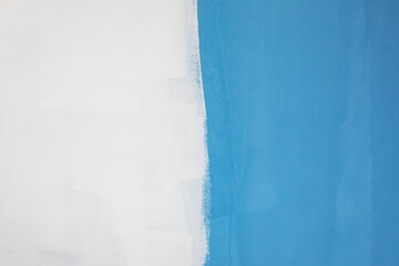 Half of the white wall painted in blue.
