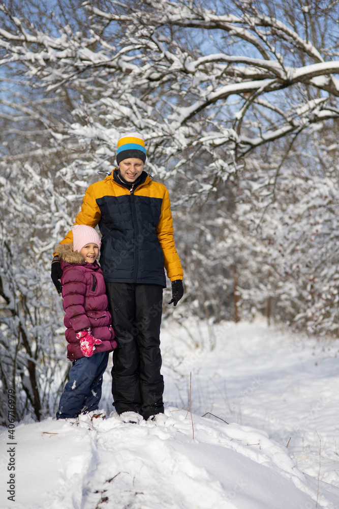 Two children on a walk in winter