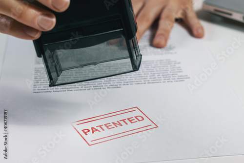 put a patented stamp on document. intellectual property protection photo