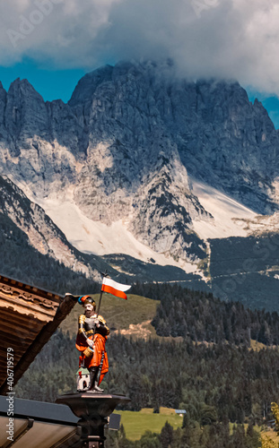 Beautiful alpine summer view with a Saint Florian statue at Ellmau, Wilder Kaiser, Tyrol, Austria