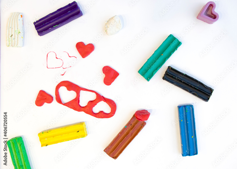 child molded a heart from plasticine, holds in his hands, top view, creativity for children, classes at home child molded a heart from plasticine, holds in his hands, top view, creativity for children, classes at home