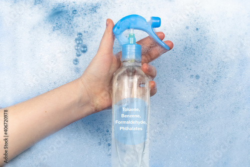 Air freshener floating in soapy water. Harmful composition of ingredients. Remedy with Toluene, Benzene, Formaldehyde, Phthalates. Concept of hazardous substances in cosmetics and household chemicals photo