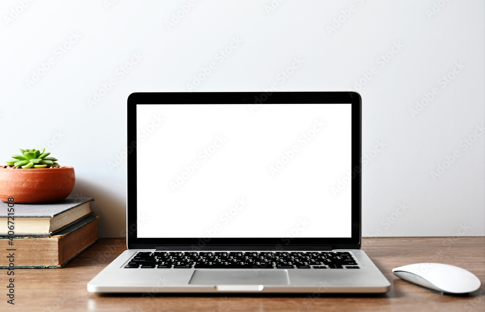 Laptop computer with blank screen in office Laptop computer with blank screen in office