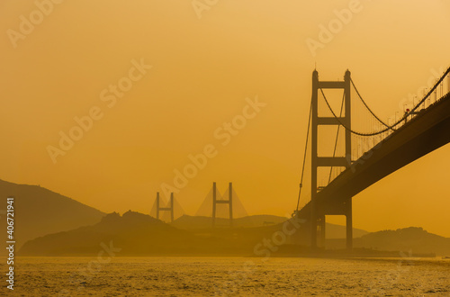 Silhouette of bridge in Hong Kong city © leeyiutung