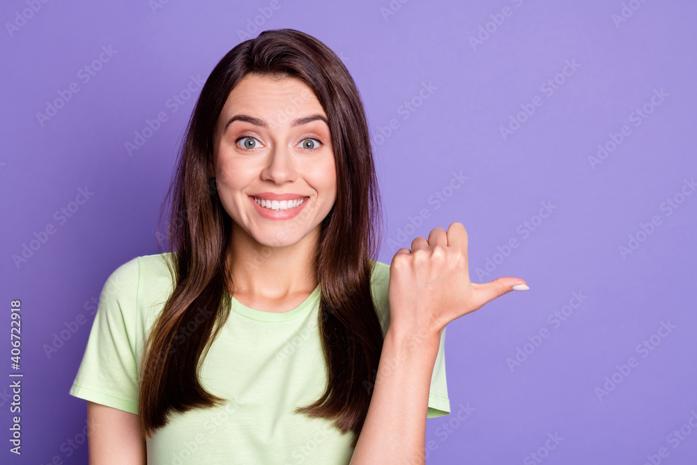 Close-up portrait of pretty cheerful girl demonstrating copy space look advert isolated over bright violet color background Close-up portrait of pretty cheerful girl demonstrating copy space look advert isolated over bright violet color background