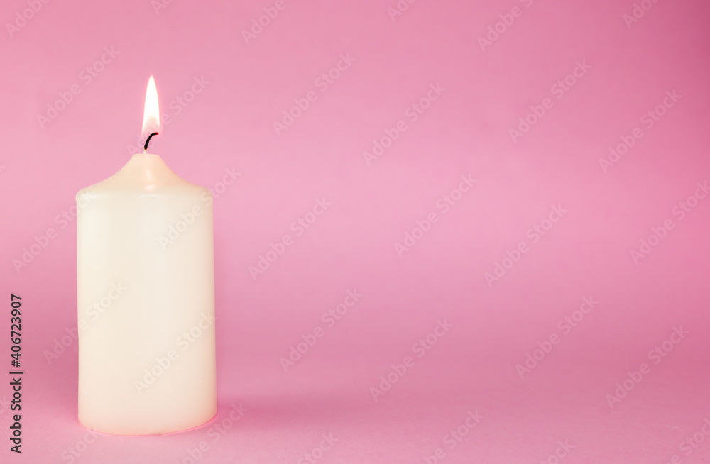 white candle on the pink background white candle on the pink background