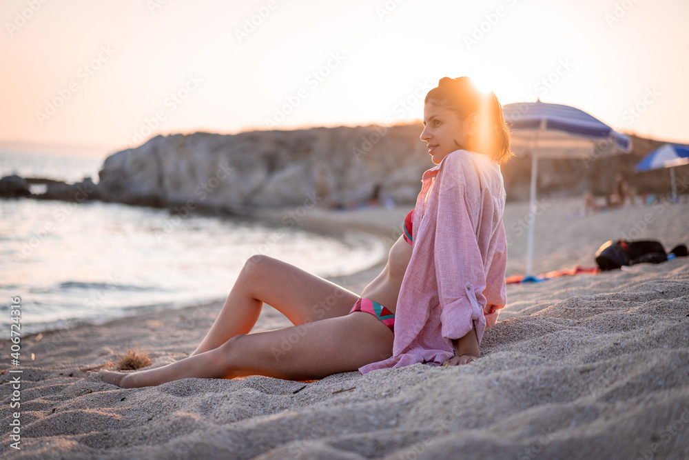Young beautiful woman having fun at beach. Summer photo of young beautiful girl. Female on beach enjoying sea vacation traveling Young beautiful woman having fun at beach. Summer photo of young beautiful girl. Female on beach enjoying sea vacation traveling