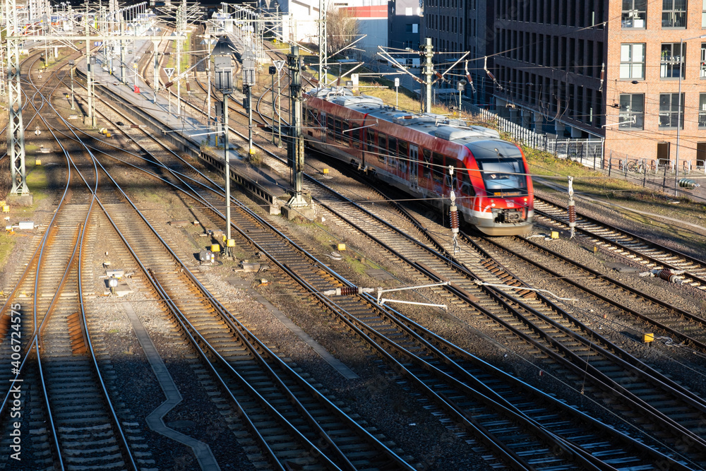 railway tracks under the bridge and a locomotive rides on them