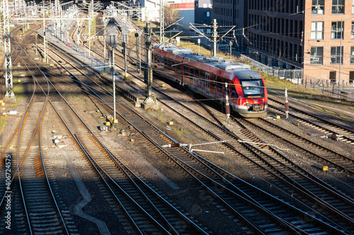 railway tracks under the bridge and a locomotive rides on them