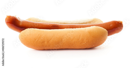 One single hot dog in a white bun. Studio photo isolated on white background.