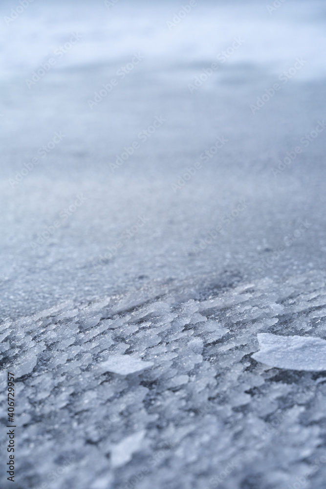 The icy texture on the frozen river. Crystal abstraction for the background. Macro ice surface shoot. The icy texture on the frozen river. Crystal abstraction for the background. Macro ice surface shoot.