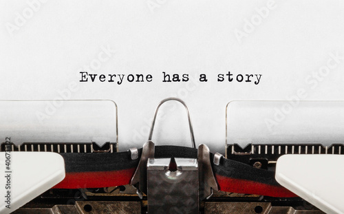 Text Everyone has a story typed on retro typewriter