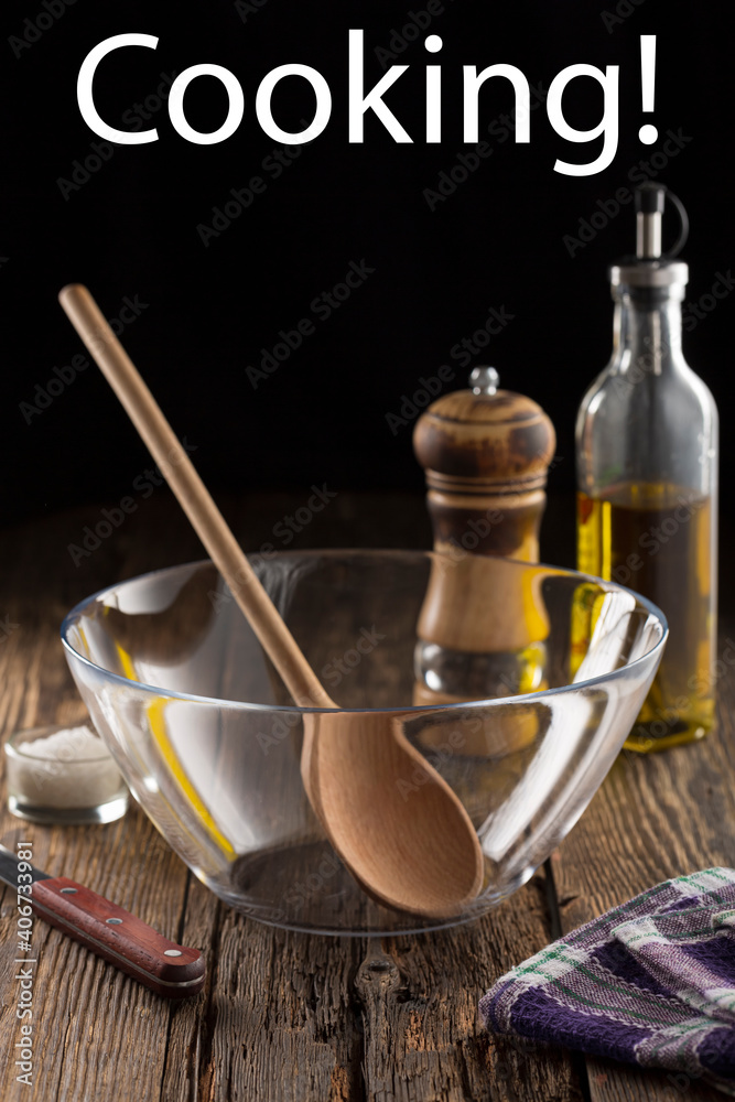 Cooking concept with utensils oil and spices in rustic kitchen interior Cooking concept with utensils oil and spices in rustic kitchen interior