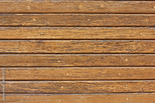 Old wooden background. Wood texture with cracks and worn brown paint.