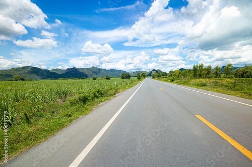 Asphalt road and landscape countryside,The Way Forward,Asphalt,Backgrounds,Beauty,Blue,Cloud - Sky,Colors,Country Road,Dividing Line - Road Marking,Driveway,Dusk,Empty,Empty Road,