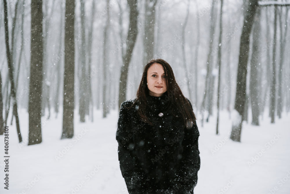 Portrait of a woman on the background of a snowy forest Portrait of a woman on the background of a snowy forest