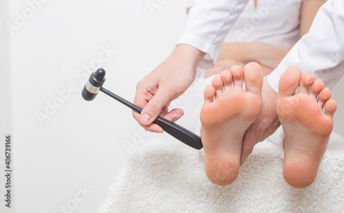 Checking cheddock reflex by a neurologist for the presence of muscle hypertonicity and paralysis diseases, paresis of limbs, copy space