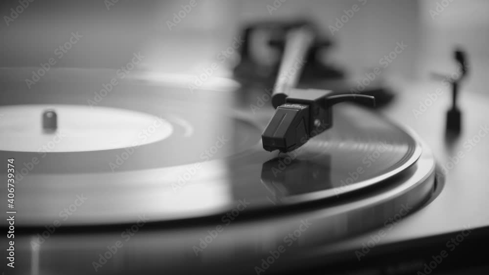 Black and White. Timelapse. The needle rises from a vintage vinyl record. The vinyl record has stopped. The vinyl record is spinning. The needle plays on a vintage vinyl record. Old turntable Black and White. Timelapse. The needle rises from a vintage vinyl record. The vinyl record has stopped. The vinyl record is spinning. The needle plays on a vintage vinyl record. Old turntable