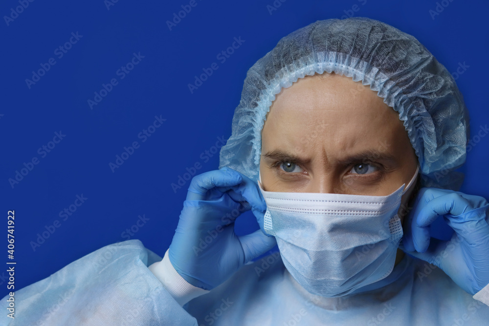 Nurse or doctor puts on medical protective mask Nurse or doctor puts on medical protective mask