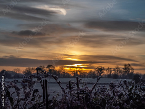 a beautiful bright sunrise on a frosty winter morning