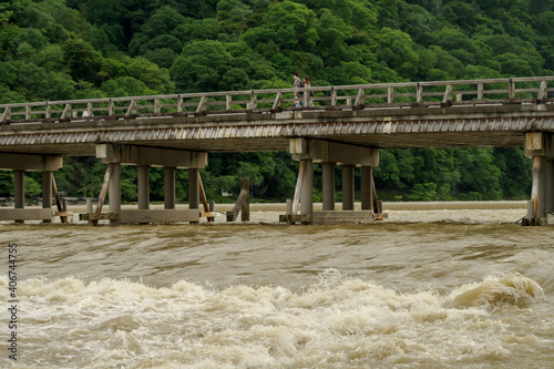 京都嵐山・増水した桂川と渡月橋 photo