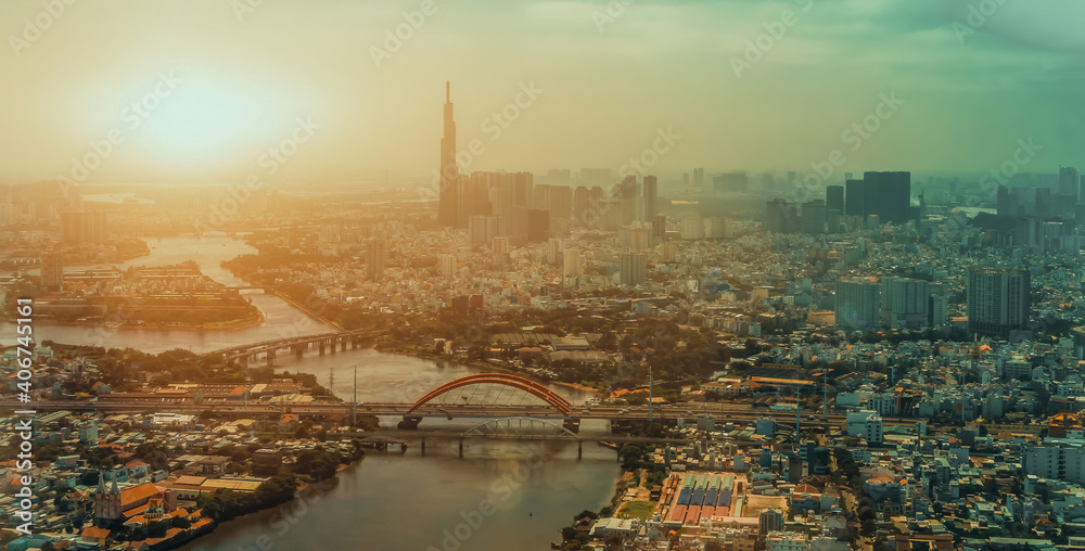 Fototapeta premium aerial view of Ho Chi Minh city, Vietnam. Beauty skyscrapers along river light smooth down urban development in Ho Chi Minh City, Vietnam
