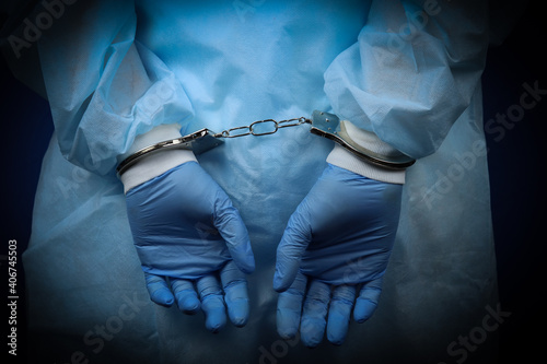 Fototapeta Doctor handcuffed, hands close-up, concept of medical corruption, bribery, crime