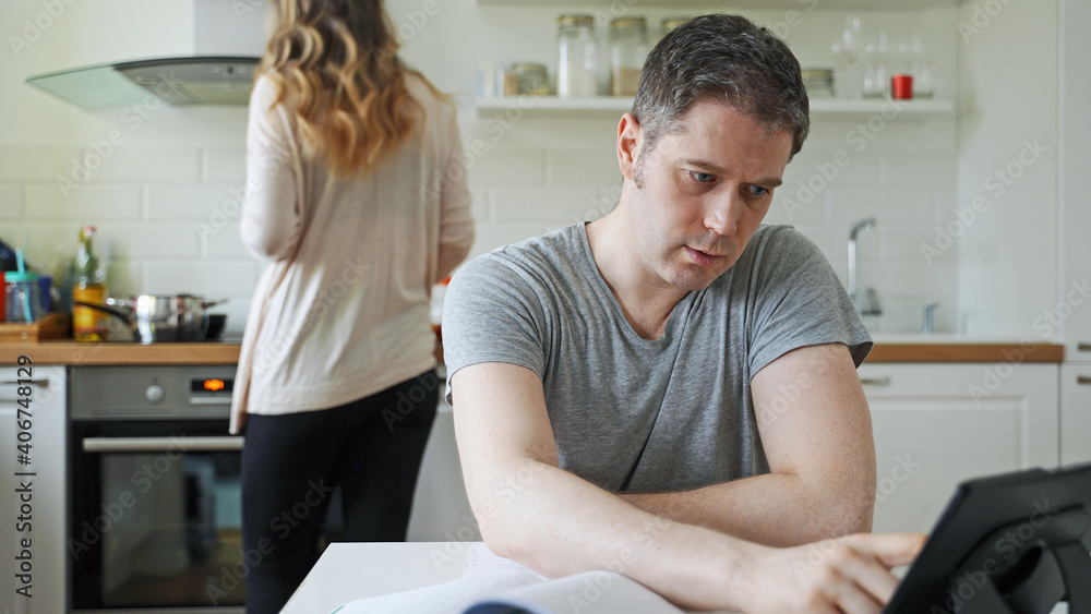 Fototapeta premium Man works at home in self-isolation. Coronavirus lockdown.