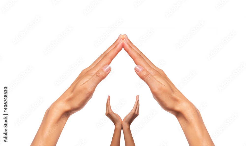 Female hands in the form of a house with a roof isolated on a white background.