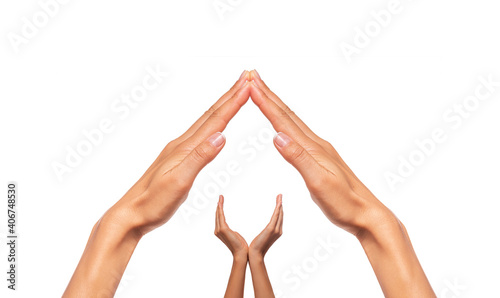Obraz na płótnie Female hands in the form of a house with a roof isolated on a white background. w salonie