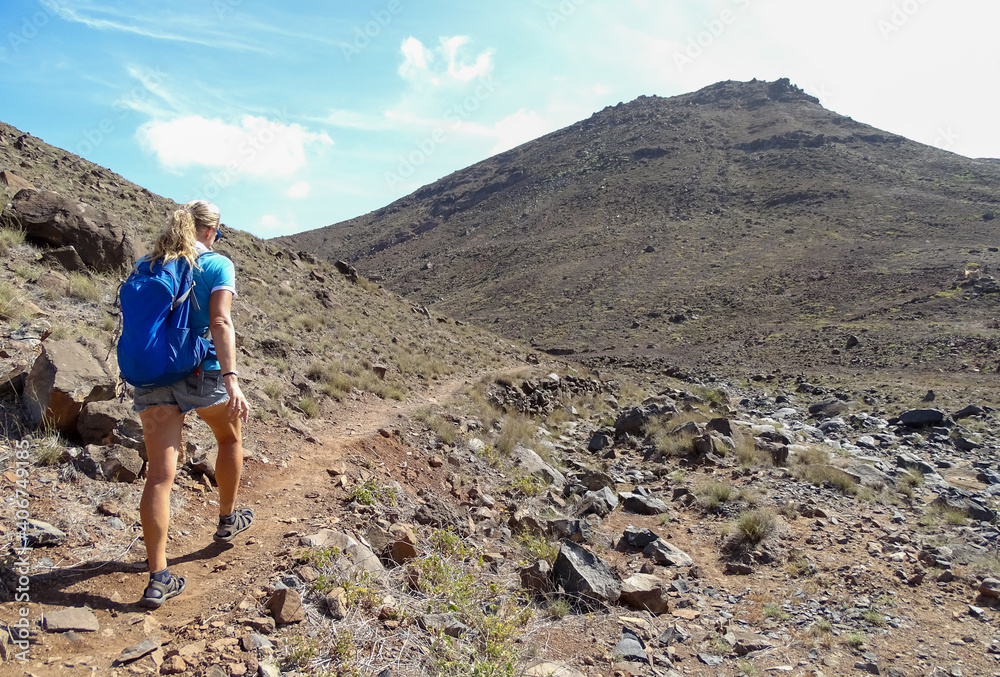 Cape Verde, walking tour at Sao Vicente island, woman, hiker on the way to the top.