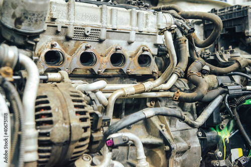 Close-up, internal combustion engine repair. The restoration of the demolished car after the accident.