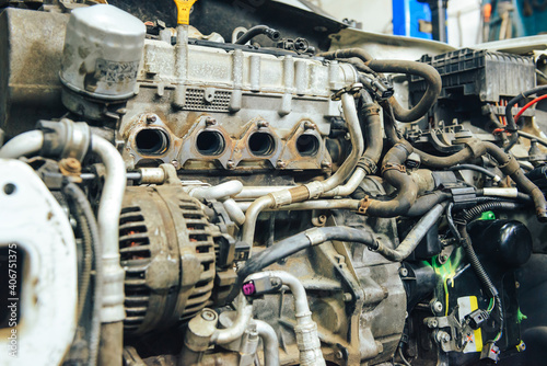 Close-up, internal combustion engine repair. The restoration of the demolished car after the accident.