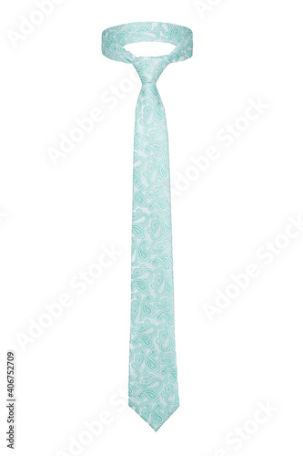 Subject shot of classic tie made of white silk with powder blue paisley pattern. The elegant necktie with knot is isolated on the white background.