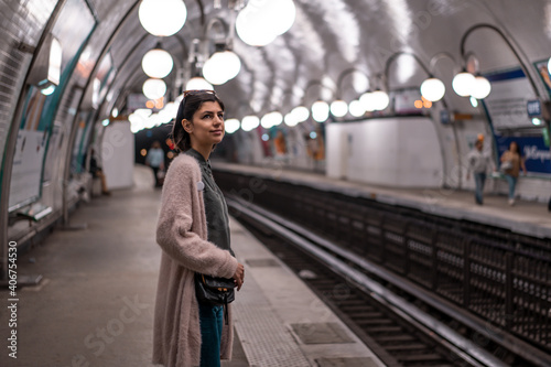 Photography Beautiful female waiting for metro in metro station