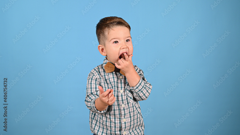 Child loves candy, on isolated background Child loves candy, on isolated background