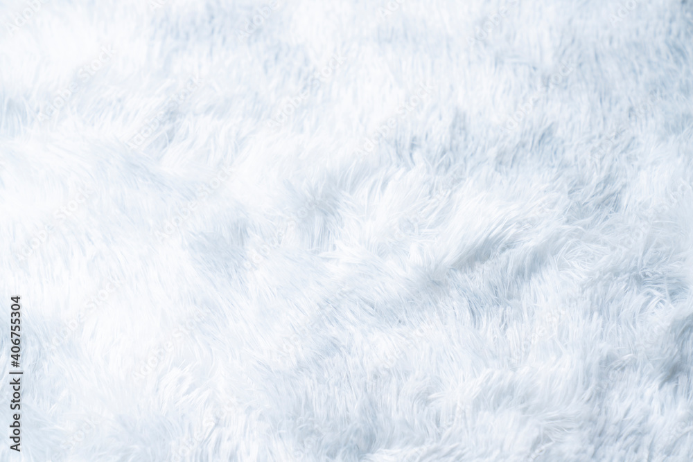 Close up white shaggy artificial fur texture or carpet for background. Close up white shaggy artificial fur texture or carpet for background.