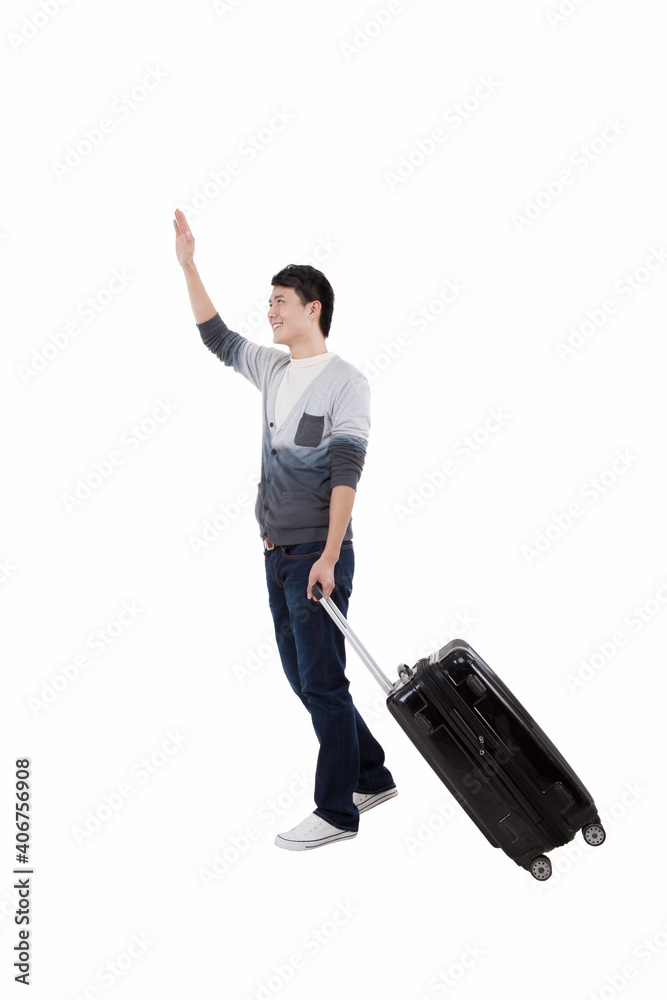 Portrait of young bisiness man pulling valise Portrait of young bisiness man pulling valise