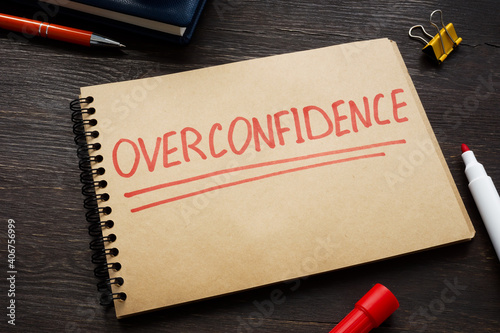 Overconfidence concept word written on the page.