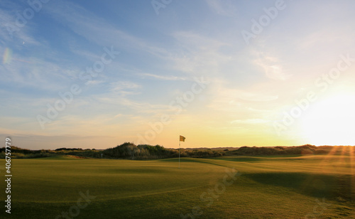 Links golf course with sunset at Texel photo