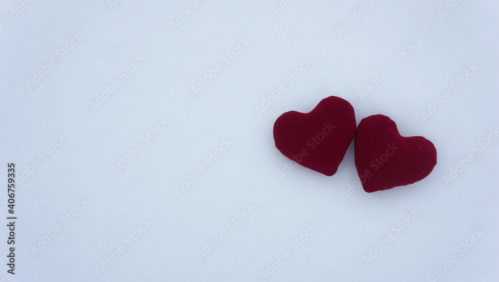 Red hearts on a snow surface Red hearts on a snow surface
